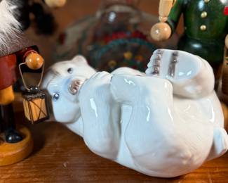 This lot features a large collection of traditional German incense smokers, also known as Räuchermännchen. Also, a decorative glass Christmas bottle and a porcelain bear manufactured by Royal Copenhagen. Maker mark present underneath as shown in photos.