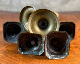 This lot features a collection of six (6) antique brass candlesticks. Three matching pairs with the tallest measuring, 9.5” H.