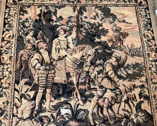 This lot features a French Aubusson-style wall tapestry, likely a handwoven replica of a 17th-century historical tapestry. This piece measures, 48” H x 48” W.