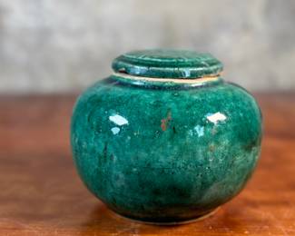 This lot features an antique Chinese green-glazed pottery ginger jar. Originally used for storing spices and herbs, the tradition of ginger jars dates back to China’s Qin dynasty. This jar measures, 4.5” H x 5.5” W x 5.5” D.