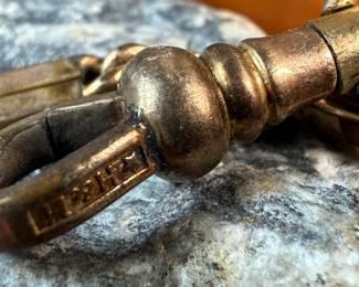 This lot features a pair of vintage pocket knives along with one being attached to a pocket knife chain, manufactured by H & H. Maker marks present as shown in photos.