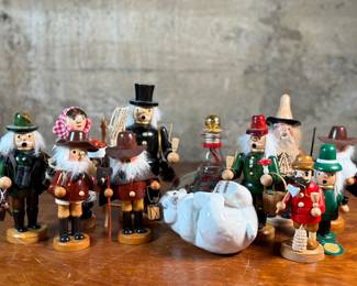 This lot features a large collection of traditional German incense smokers, also known as Räuchermännchen. Also, a decorative glass Christmas bottle and a porcelain bear manufactured by Royal Copenhagen. Maker mark present underneath as shown in photos.