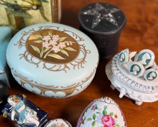 This lot features a large collection of antique jewelry and trinket boxes made from various materials by makers around the world.