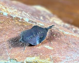 This lot features a sterling silver pendant with a turquoise stone, signed by listed artist, David F. Garcia. This pendant measures, 1.25” H and has a total approx. weight of 3.50 grams.
