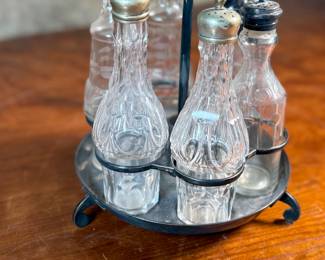 This lot features a Victorian cruet set, manufactured by Wildman’s. Maker marks present underneath as shown in photos. This cruet set measures, 10” H x 7” W x 7” D.