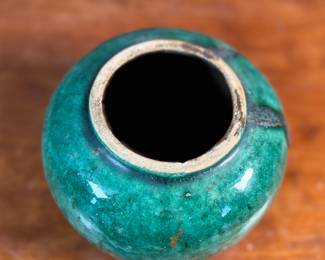 This lot features an antique Chinese green-glazed pottery ginger jar. Originally used for storing spices and herbs, the tradition of ginger jars dates back to China’s Qin dynasty. This jar measures, 4.5” H x 5.5” W x 5.5” D.