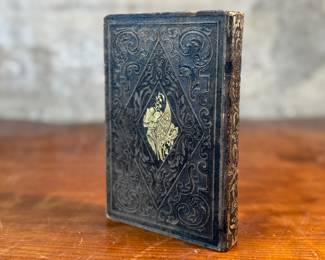 This lot features an antique hardcover book of, "The Lily of the Valley", edited by Elizabeth Doten circa 1854.