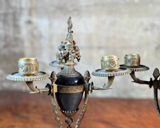 This lot features a pair of antique French gilt bronze and black marble candelabras in very good condition. Each one measures, 12” H x 8” W x 8” D.