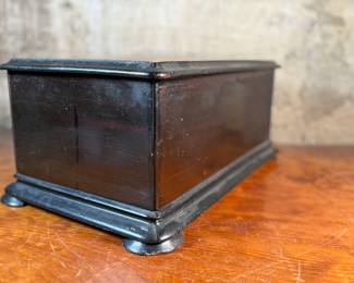 This lot features a large 19th century wooden box that measures, 8” H x 18” W x 11” D.