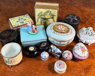 This lot features a large collection of antique jewelry and trinket boxes made from various materials by makers around the world.
