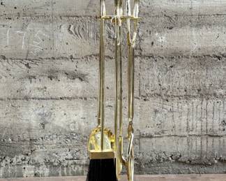 This lot features a mid-century fireplace tool set in excellent condition.