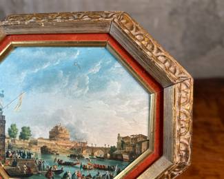 This lot features an Italian gilt wood frame with a print inside. This piece measures in frame, 13” H x 16” W.