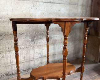 This lot features a solid wood oval shaped parlor table that measures, 29” H x 30” W x 20” D.