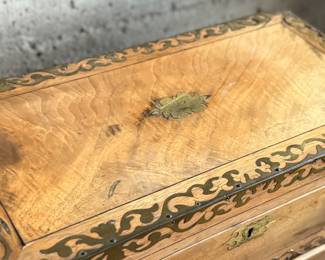 This lot features an incredible 19th century Italian travel desk on a wooden stand. The travel desk is removable and features numerous drawers and compartments inside. This piece measures (on the stand), 26” H x 20” W x 11” D.