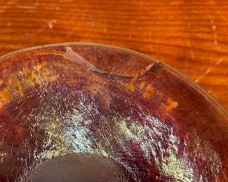 This lot features an iridescent gold Tiffany Favrile sherbet glass with maker marks present underneath as shown in photos. One small repair on the foot ring and measures, 3.5” H x 4” W x 4” D.