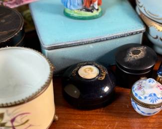 This lot features a large collection of antique jewelry and trinket boxes made from various materials by makers around the world.