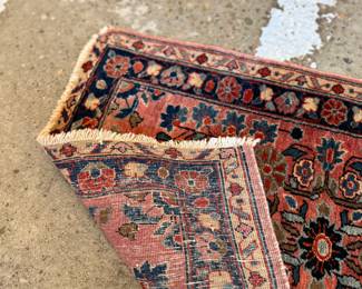 This lot features a Persian Sarouk rug that measures, 32” H x 22.5” W.