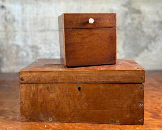 This lot features a pair of 19th century wooden boxes in good overall condition given their age. The largest measures, 5.25” H x 10.75” W x 5.75” D.