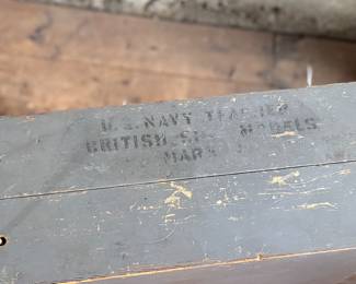 This lot features a complete set of WWII U.S. Navy recognition ship models in their original, self-contained wooden display case. These sets were manufactured by H.A. Framburg & Co. for the U.S. Navy Bureau of Aeronautics to help personnel identify friendly and enemy vessels during the war. This set measures (closed), 18.5” H x 36.5” W x 6.75” D. These models are generally considered 1/1200 scale, and were used as identification and training aids for the Navy during World War II.