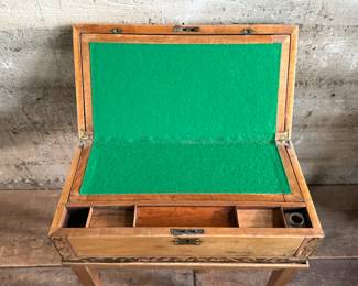 This lot features an incredible 19th century Italian travel desk on a wooden stand. The travel desk is removable and features numerous drawers and compartments inside. This piece measures (on the stand), 26” H x 20” W x 11” D.