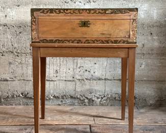 This lot features an incredible 19th century Italian travel desk on a wooden stand. The travel desk is removable and features numerous drawers and compartments inside. This piece measures (on the stand), 26” H x 20” W x 11” D.