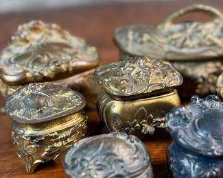 This lot features a large collection of Art Nouveau-style metal jewelry caskets or trinket boxes.