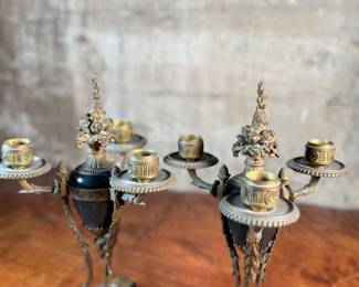 This lot features a pair of antique French gilt bronze and black marble candelabras in very good condition. Each one measures, 12” H x 8” W x 8” D.
