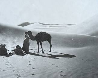 “Arab Desert Scenes”, three professionally framed silver gelatin prints by listed photographers, Rudolf Franz Lehnert & Ernst Heinrich Landrock. Measures in frame, 10” H x 30” W. Rudolf Franz Lehnert (1878-1948) and Ernst Heinrich Landrock (1880-1957), a renowned photographic team of the early 20th century, known for their Orientalist images, often featuring desert scenes with camels and local inhabitants, distributed as original prints, photogravures, and postcards.