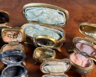 This lot features a large collection of Art Nouveau-style metal jewelry caskets or trinket boxes.