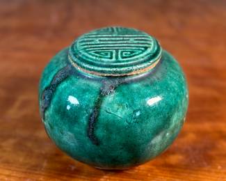 This lot features an antique Chinese green-glazed pottery ginger jar. Originally used for storing spices and herbs, the tradition of ginger jars dates back to China’s Qin dynasty. This jar measures, 4.5” H x 5.5” W x 5.5” D.