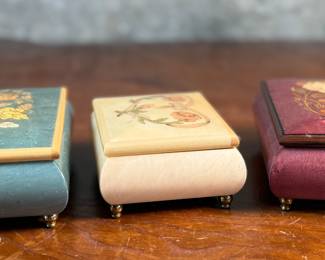 This lot features three (3) music boxes, all manufactured by The San Francisco Music Box Company. All three are in good overall condition with maker mark present underneath as shown in photos.