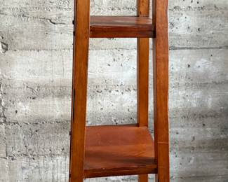 This lot features a modern three-tier shelving unit that measures, 60” H x 15” W x 15” D.