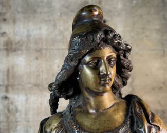 This lot features a large bronze bust depicting Marianne of France. Hollow inside as shown in photos, but quite heavy and well-made. This sculpture measures, 26” H x 16” W x 8” D.