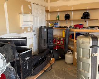 Lots of miscellaneous Garage items like golf club bags for airplanes