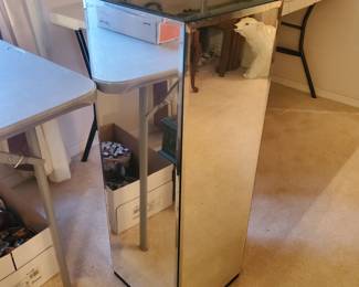 Mirrored stand approx. 4' tall.