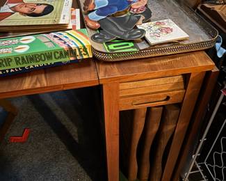 A very cool mid-century, modern table and chairs set. The table folds down, and the chairs are stored inside the table.