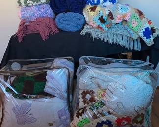 A Huge Batch Of Homemade Blankets Of Various Colors And sizes