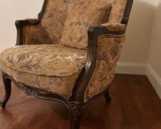 Louis XV style Bergère
18th Century Rococo style design armchair, featuring a carved wood frame and ornate upholstery