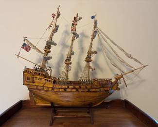 A stunning, one-of-a-kind vintage ship model, meticulously handcrafted from wood, canvas, and string. Perfect for collectors and maritime enthusiasts alike!