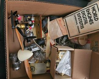 Box full of vintage model airplane parts