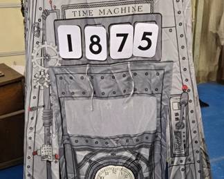 A pop-up playhouse tent time machine by Asweets. Comes with velcro numbers so you can set the date you want to travel to. Brand new and unused.