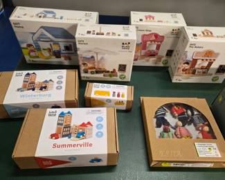 Various wooden playsets by Plan Toys, Lubulona, and Magic Cabin. All new. 