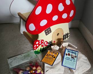 Wooden mushroom dollhouse, made in Germany. Comes with wooden branch furniture and a little family of gnome dolls. 