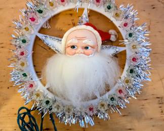 1950s Santa tree topper with multi colored electric lights. In working condition.