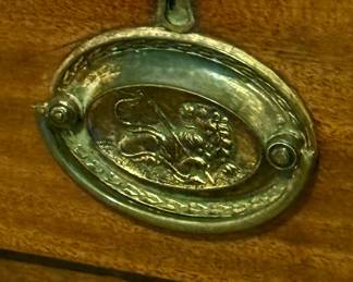 Original stamped brass hardware with lion coat of arms design