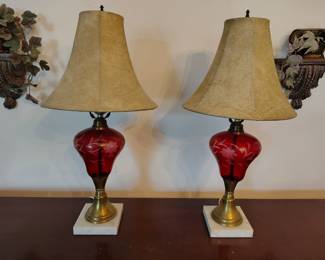 Cranberry glass lamps with marble base.
