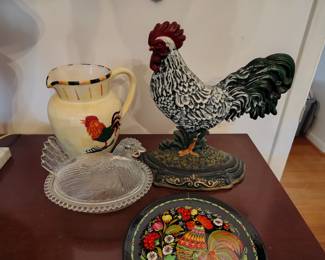 Lots of chickens including a cast iron chicken door stop.