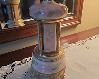 music box lipstick holder.  4 doors open and spins