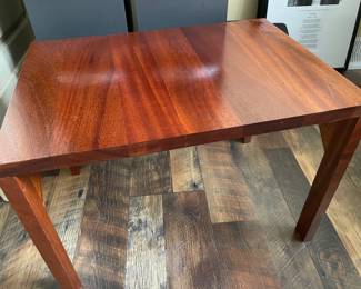 Short solid mahogany table or stereo receiver stand.