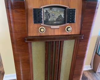 Here we have a floor radio made in December of 1941 refinished with a new speaker and a Bluetooth receiver to play your personalized music selection. This is a real beauty.